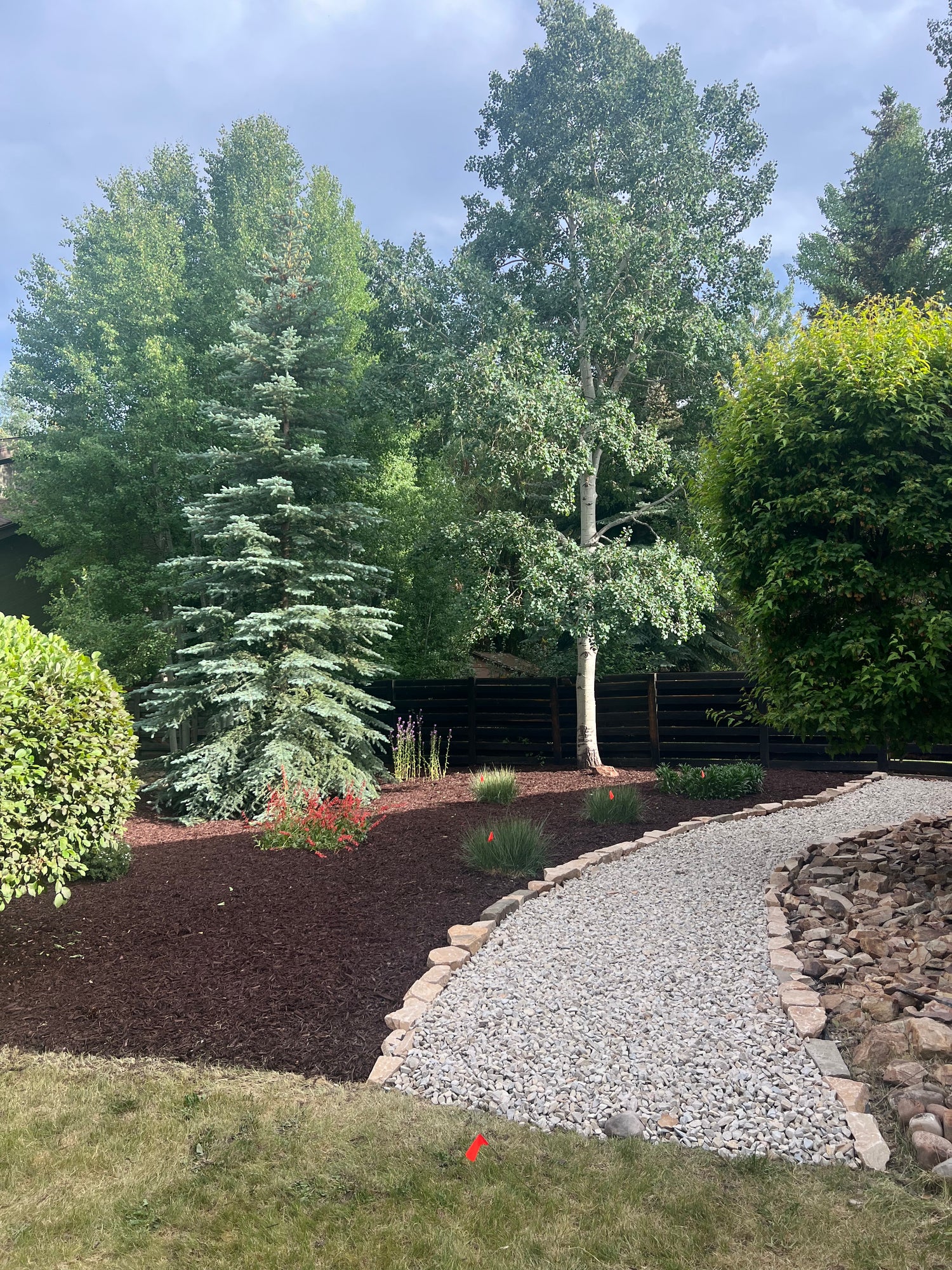 Mulch, rock, and pathway transition in a Park City landscape