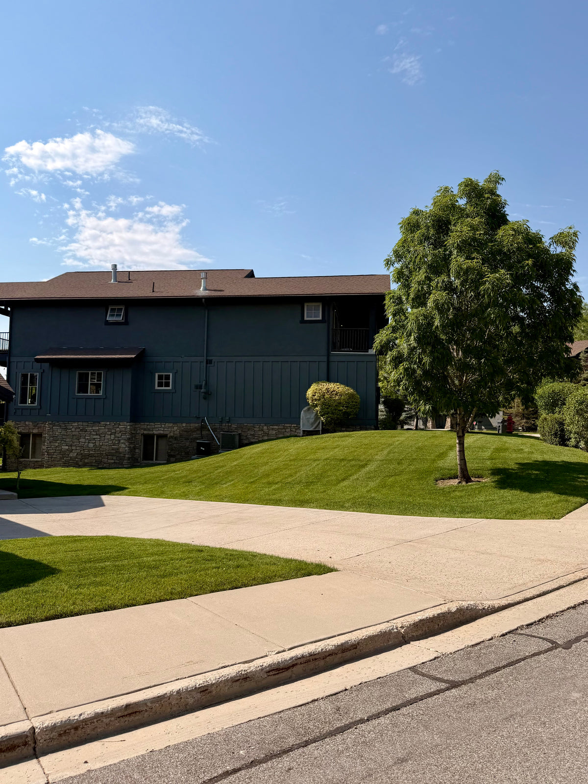 Striped lawn in front of an HOA building in Park City